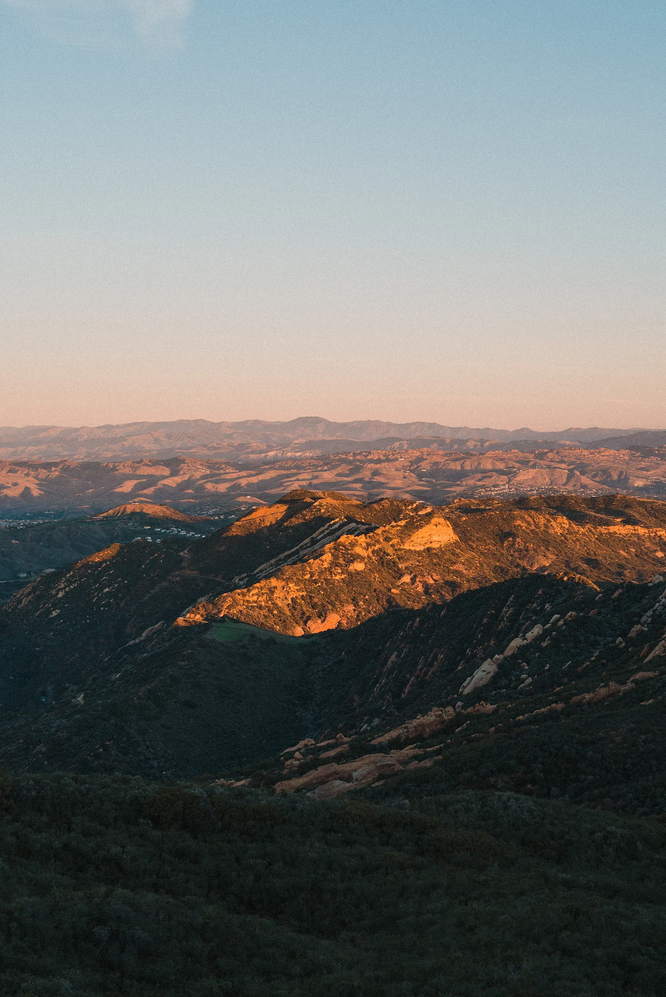 Golden light spilling across the hills